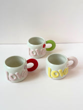 Load image into Gallery viewer, Handmade LOVE Ceramic Mug – Colorful Handle &amp; Flower Accent

