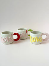 Load image into Gallery viewer, Handmade LOVE Ceramic Mug – Colorful Handle &amp; Flower Accent
